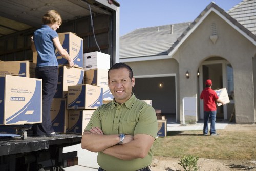 Loading a removal truck with furniture and boxes