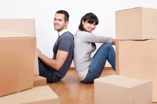Packed office furniture and labelled boxes ready for commercial moves in Harringay