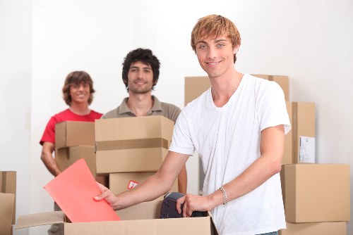 Packed boxes and furniture prepared for a removal van in Harringay
