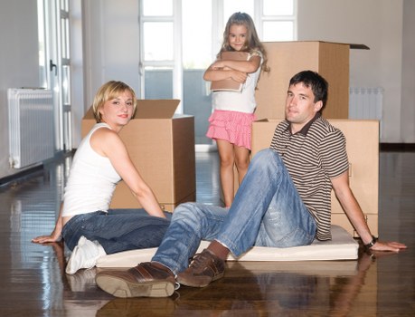 Local moving team transporting boxes and furniture in Harringay